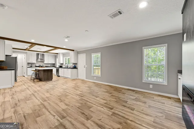 a view of kitchen with wooden floor