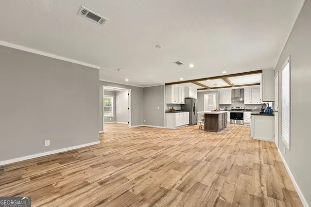 a view of kitchen with wooden floor