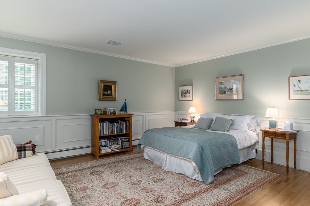 11 Thissell Street, Unit 3 Beverly, MA 01915 - Photo 15 of 31 a bedroom with a bed and a window