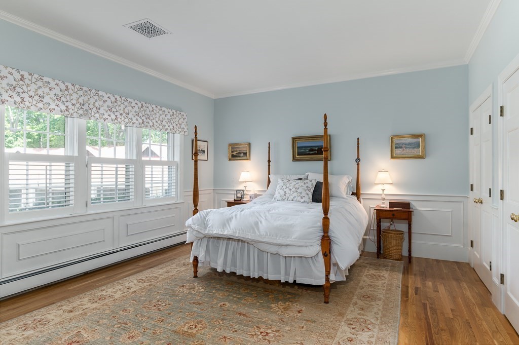 11 Thissell Street, Unit 3 Beverly, MA 01915 - Photo 16 of 31 a bed room with a bed and a couch