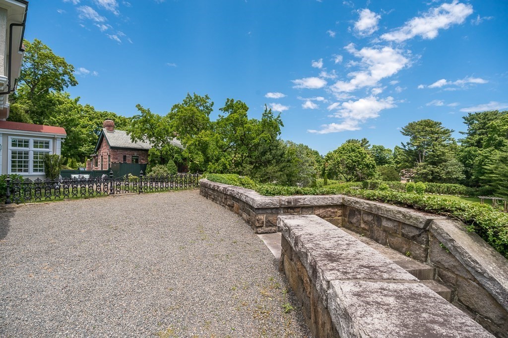 11 Thissell Street, Unit 3 Beverly, MA 01915 - Photo 27 of 31 a view of a street with a yard and a house