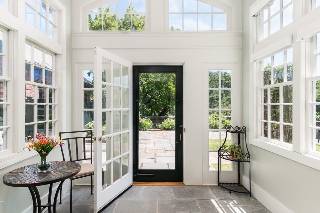 11 Thissell Street, Unit 3 Beverly, MA 01915 - Photo 3 of 31 a view of front door of house with outdoor seating