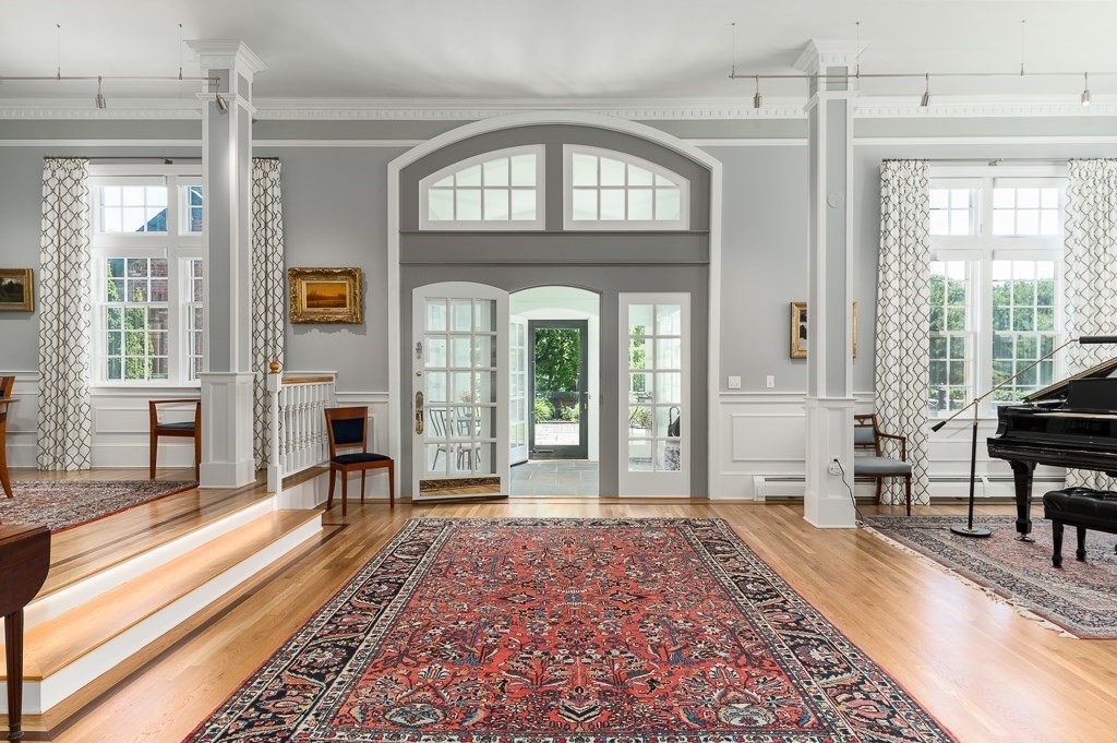 11 Thissell Street, Unit 3 Beverly, MA 01915 - Photo 4 of 31 a living room with furniture and a fireplace