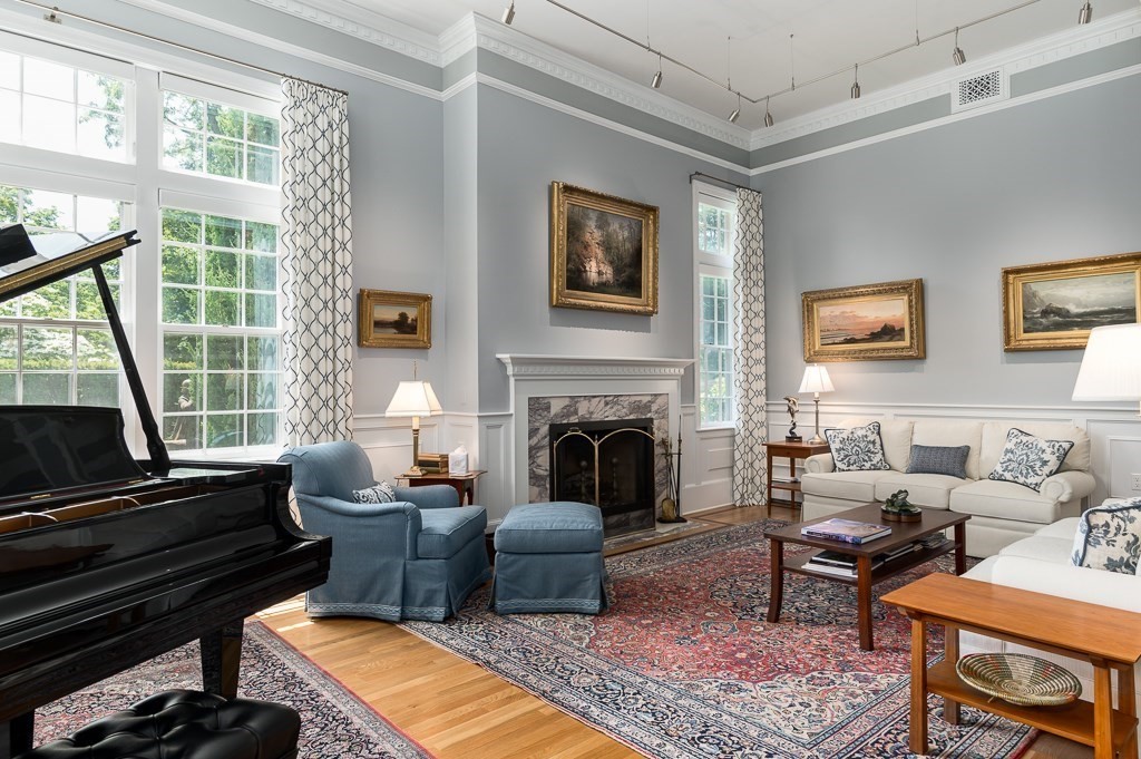 11 Thissell Street, Unit 3 Beverly, MA 01915 - Photo 5 of 31 a living room with furniture fireplace and window