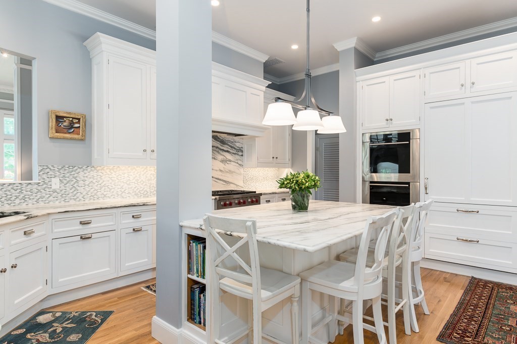 11 Thissell Street, Unit 3 Beverly, MA 01915 - Photo 7 of 31 a kitchen with granite countertop cabinets and chairs
