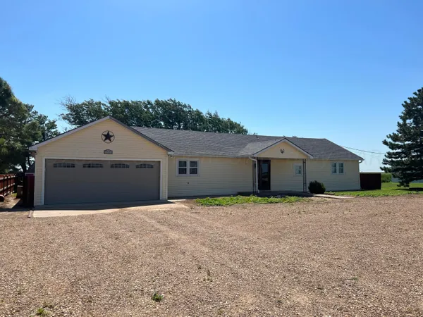 a house with a field in front of it