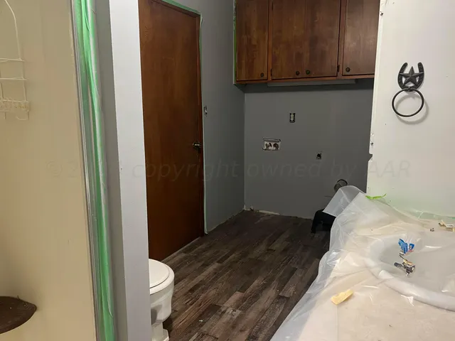 a bedroom with a bed and cabinets