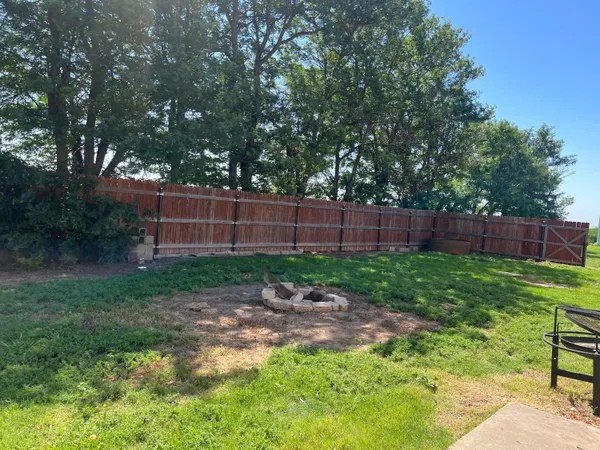 a view of backyard with green space