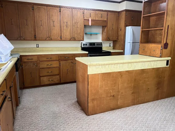 a kitchen with a cabinets and appliances