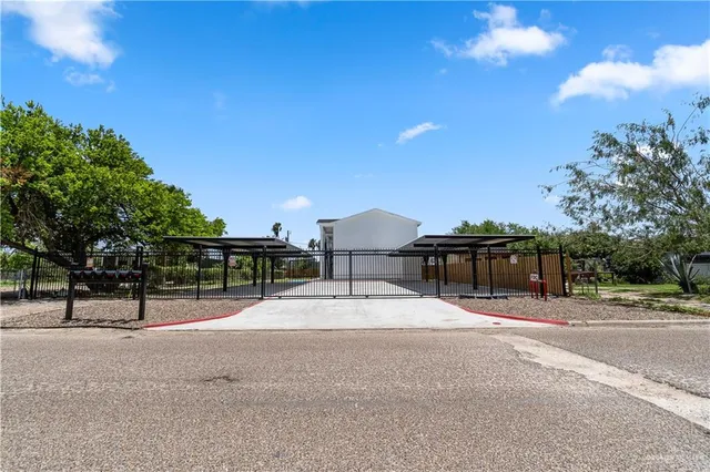 a swimming pool with an outdoor space and seating area