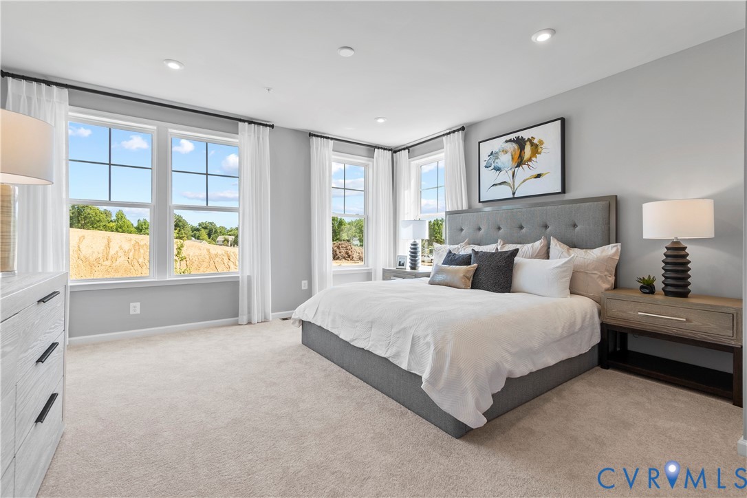 3611 Edna Path, Unit A Richmond, VA 23233 - Photo 13 of 32 a spacious bedroom with a bed and a large window