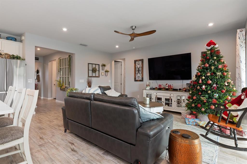 11819 Sistine Lane Venice, FL 34293 - Photo 14 of 90 a living room with furniture and a flat screen tv