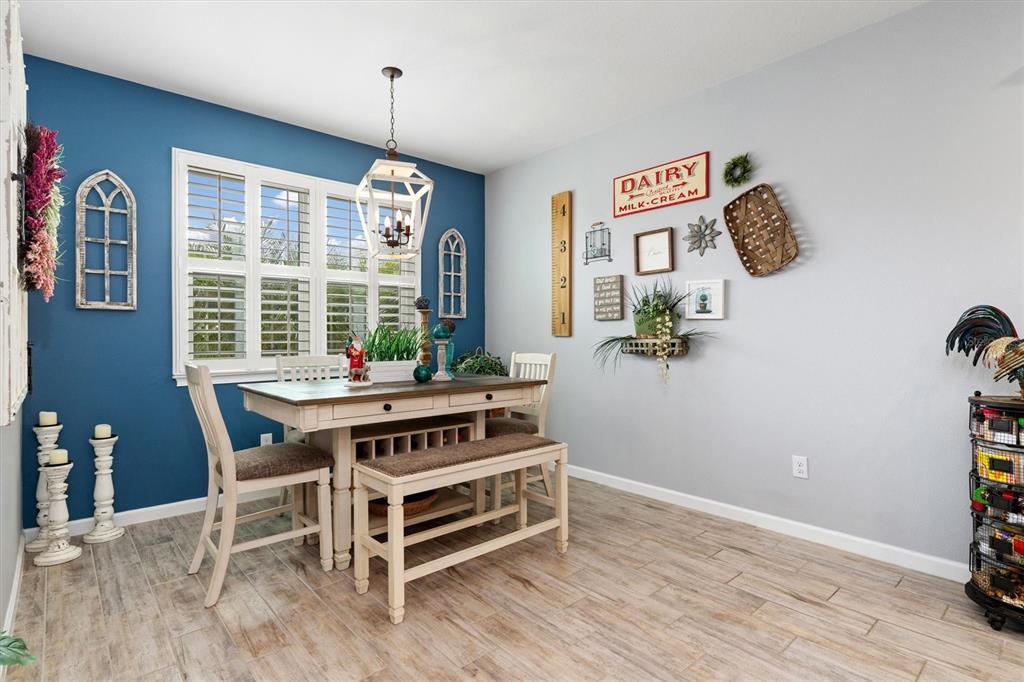 11819 Sistine Lane Venice, FL 34293 - Photo 18 of 90 a view of a dining room with furniture window and outside view