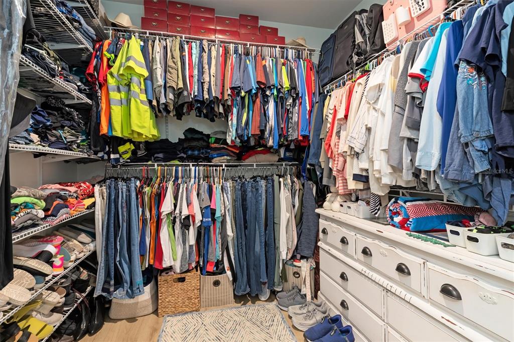 11819 Sistine Lane Venice, FL 34293 - Photo 25 of 90 a view of walk in closet with clothes