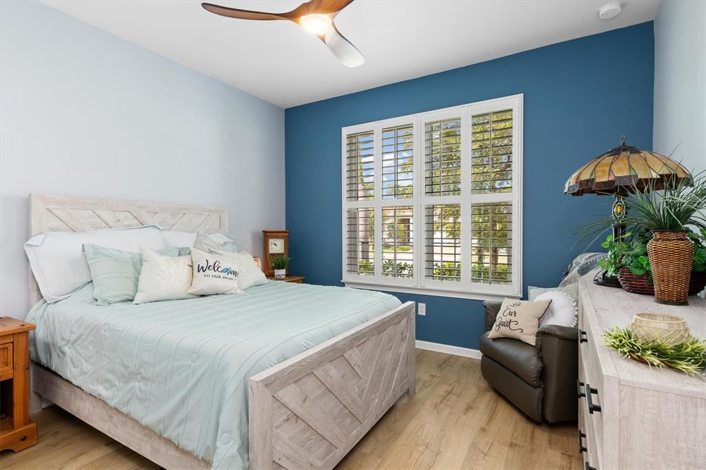 11819 Sistine Lane Venice, FL 34293 - Photo 26 of 90 a bedroom with a bed and a couch