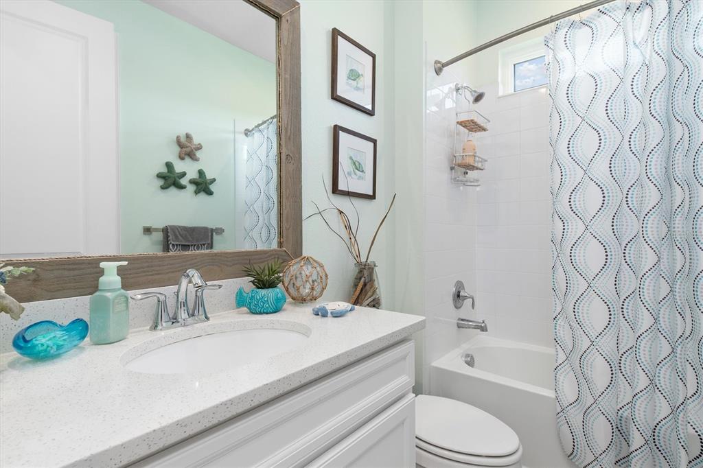 11819 Sistine Lane Venice, FL 34293 - Photo 27 of 90 a bathroom with a sink a toilet and a bathtub