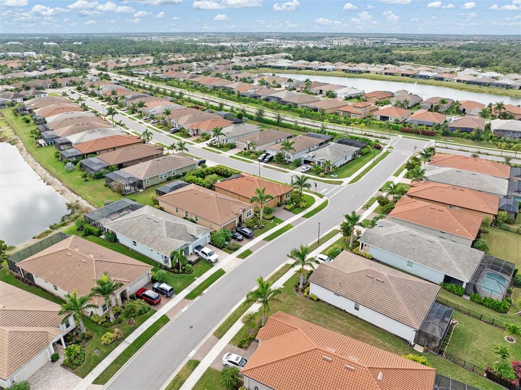 11819 Sistine Lane Venice, FL 34293 - Photo 38 of 90 an aerial view of a city with lots of residential buildings