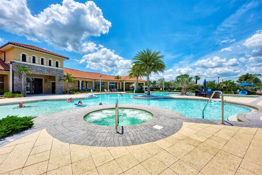 11819 Sistine Lane Venice, FL 34293 - Photo 53 of 90 a view of a swimming pool with a garden