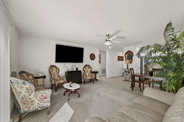 a kitchen with stainless steel appliances a sink a stove a microwave and cabinets