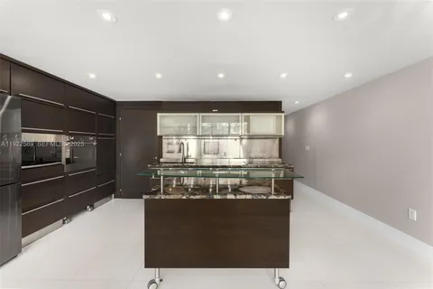 a kitchen with a stove and a refrigerator