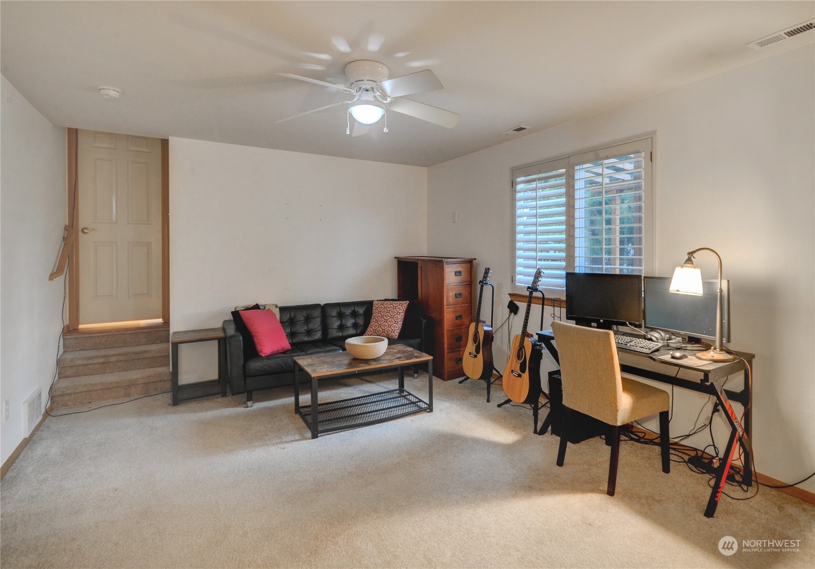 310 216th Street Southwest Bothell, WA 98021 - Photo 13 of 28 a living room with furniture and a fireplace