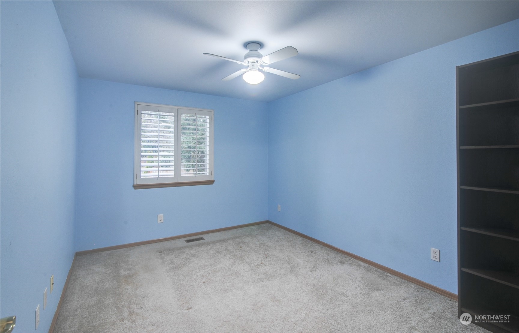 310 216th Street Southwest Bothell, WA 98021 - Photo 18 of 28 an empty room with windows and fan