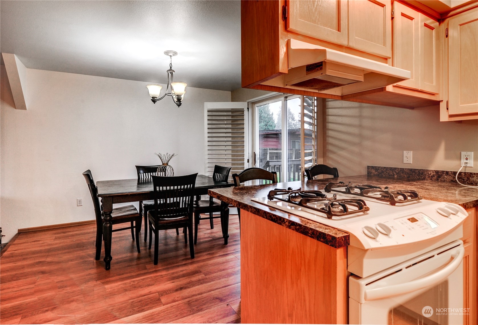 310 216th Street Southwest Bothell, WA 98021 - Photo 8 of 28 a table and chairs in a kitchen
