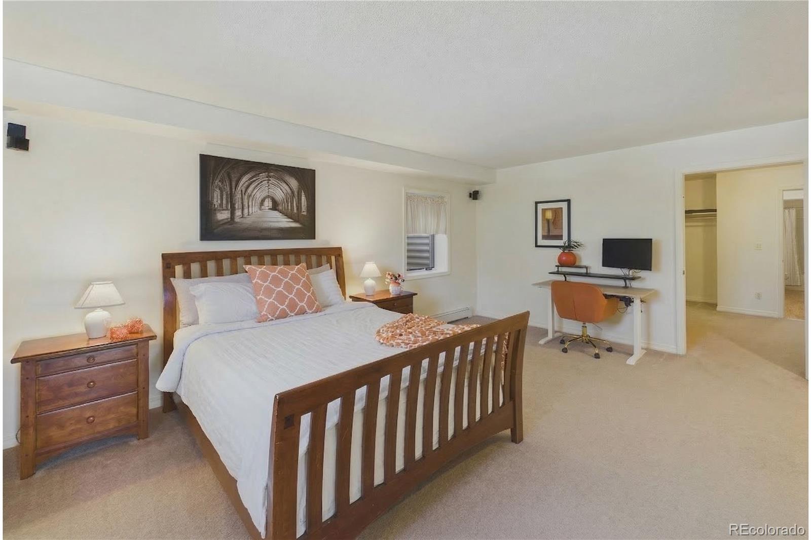 10798 Crystal Way Morrison, CO 80465 - Photo 26 of 36 a bedroom with a bed and a tv on table