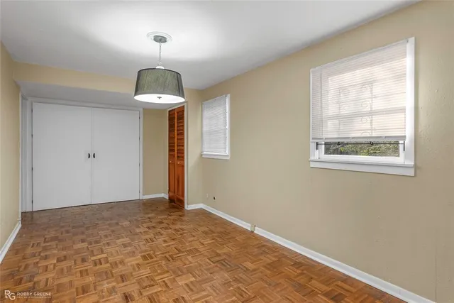 a view of an empty room with a window