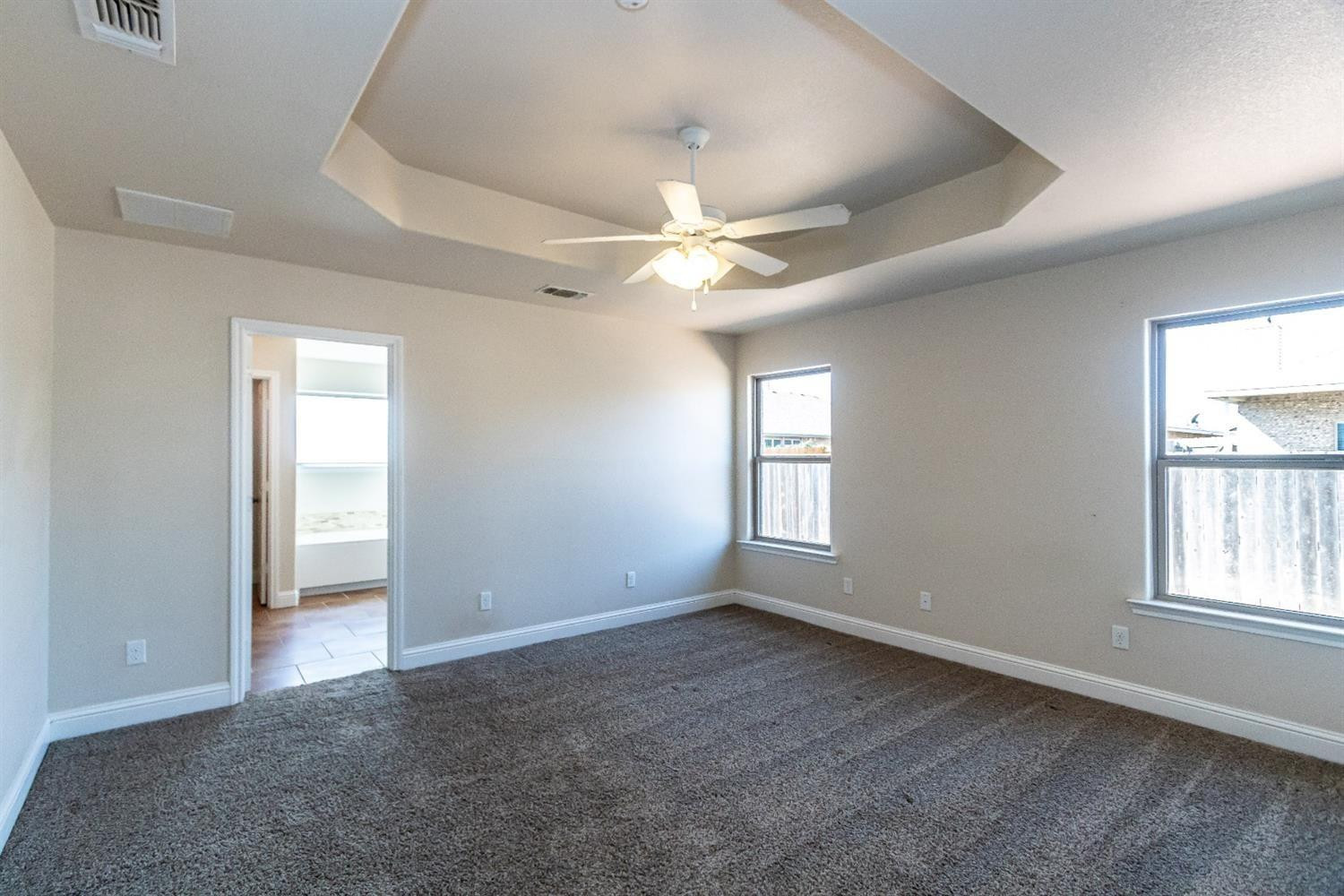 9706 Ridgely Avenue Lubbock, TX 79424 - Photo 12 of 32 a view of an empty room with a window