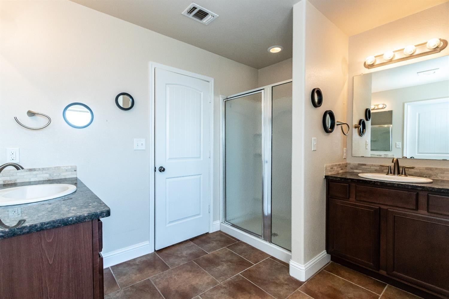 9706 Ridgely Avenue Lubbock, TX 79424 - Photo 20 of 34 a bathroom with a sink and a mirror