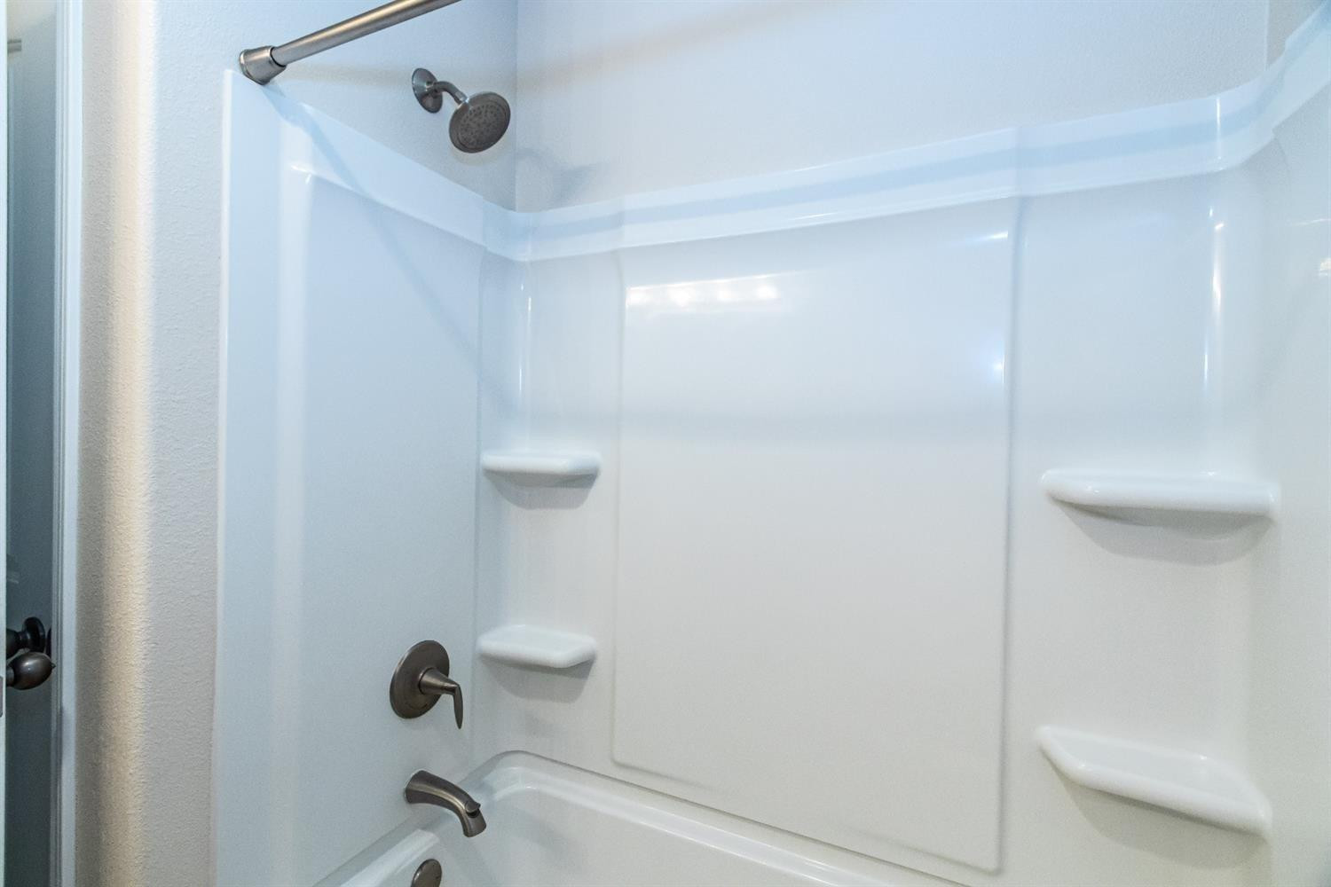 9706 Ridgely Avenue Lubbock, TX 79424 - Photo 28 of 32 a bathroom with a shower