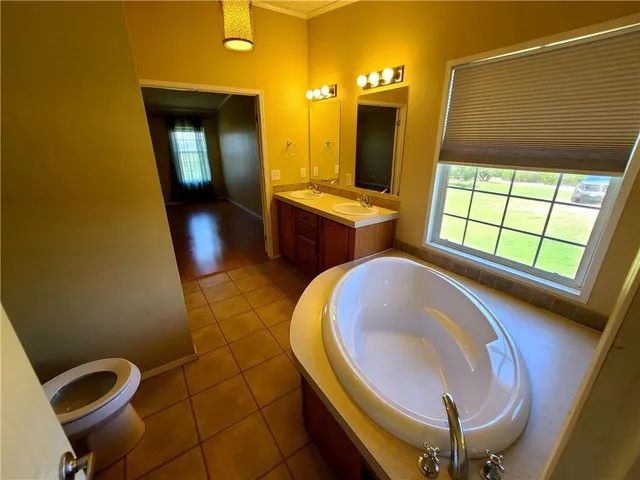 a bathroom with a mirror and a sink