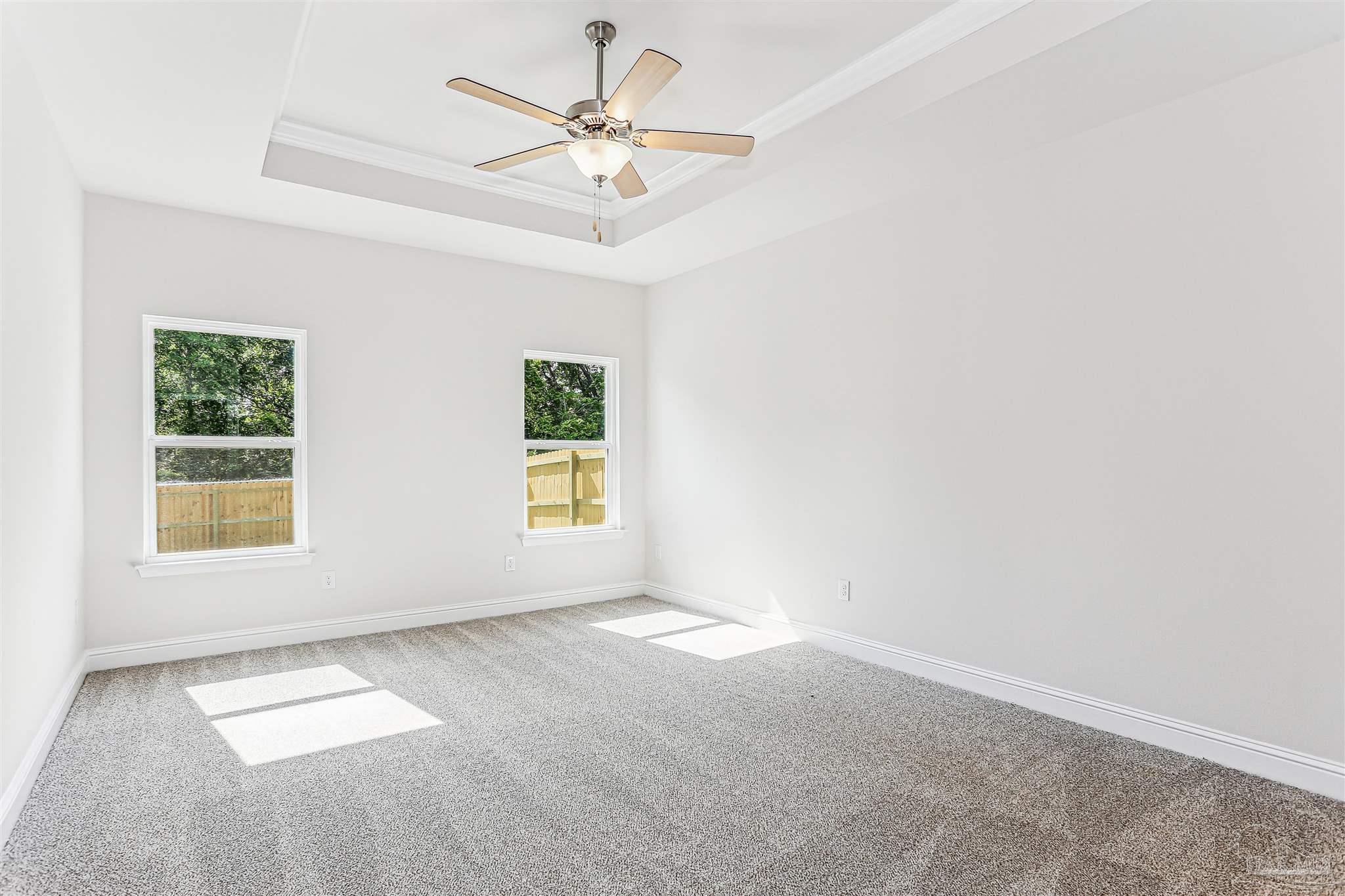 1644 Slate Drive Cantonment, FL 32533 - Photo 12 of 28 an empty room with windows and fan