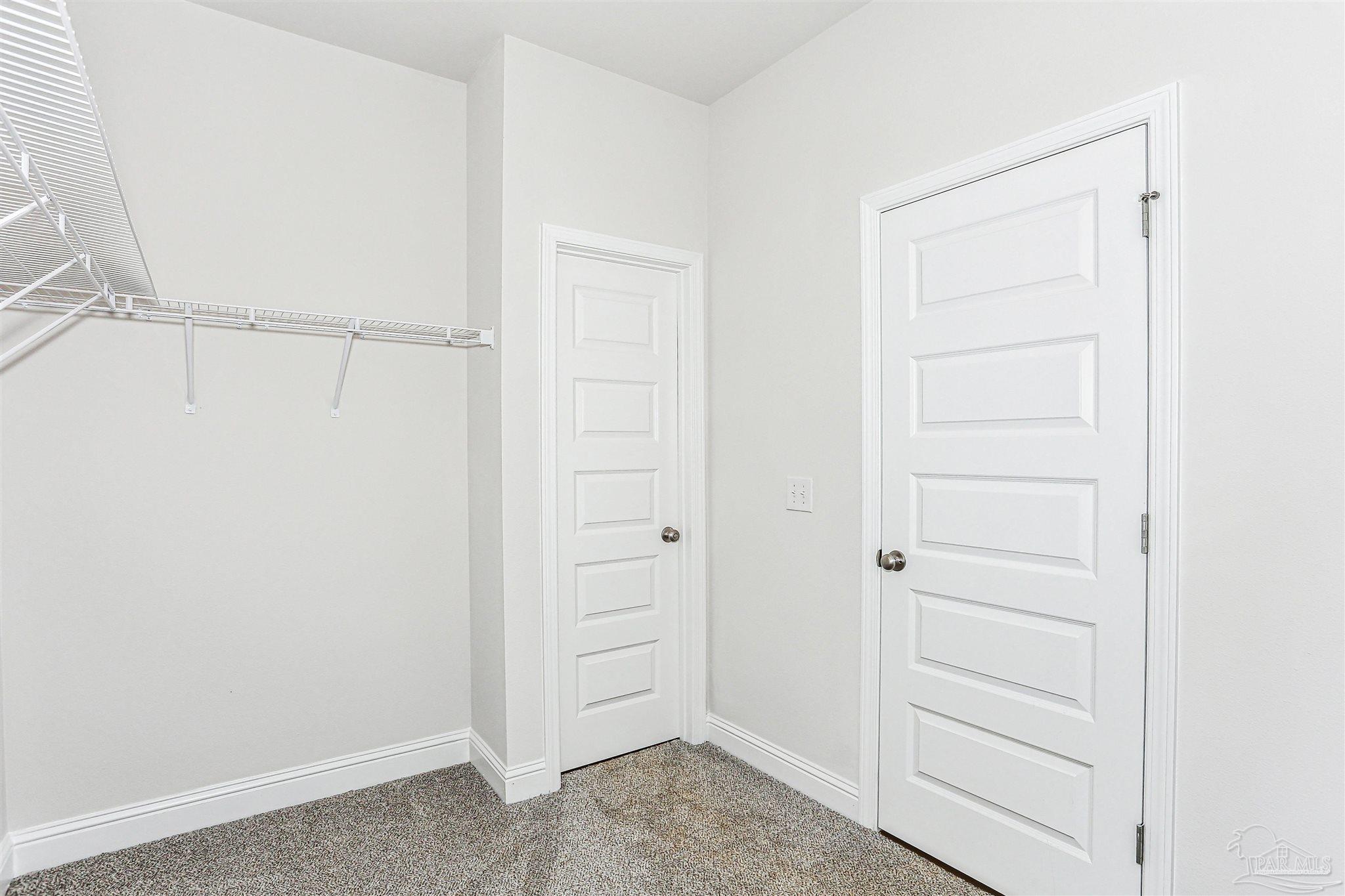 1644 Slate Drive Cantonment, FL 32533 - Photo 17 of 28 a view of an empty walk in closet