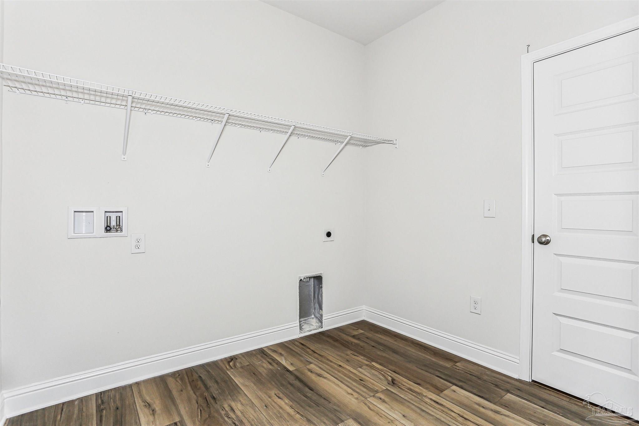 1644 Slate Drive Cantonment, FL 32533 - Photo 18 of 28 a view of a room with wooden floor