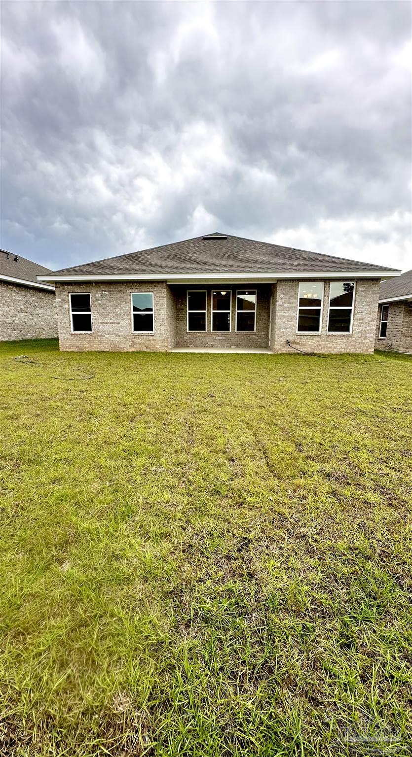 1644 Slate Drive Cantonment, FL 32533 - Photo 25 of 28 a house view with a garden space