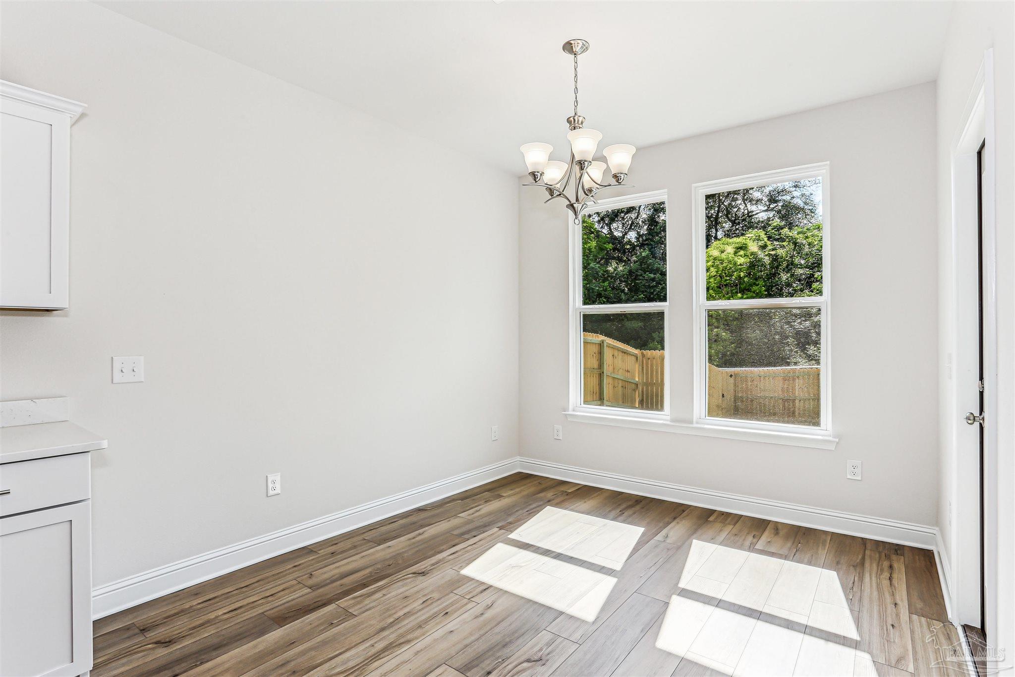 1644 Slate Drive Cantonment, FL 32533 - Photo 6 of 28 a view of an empty room with a window