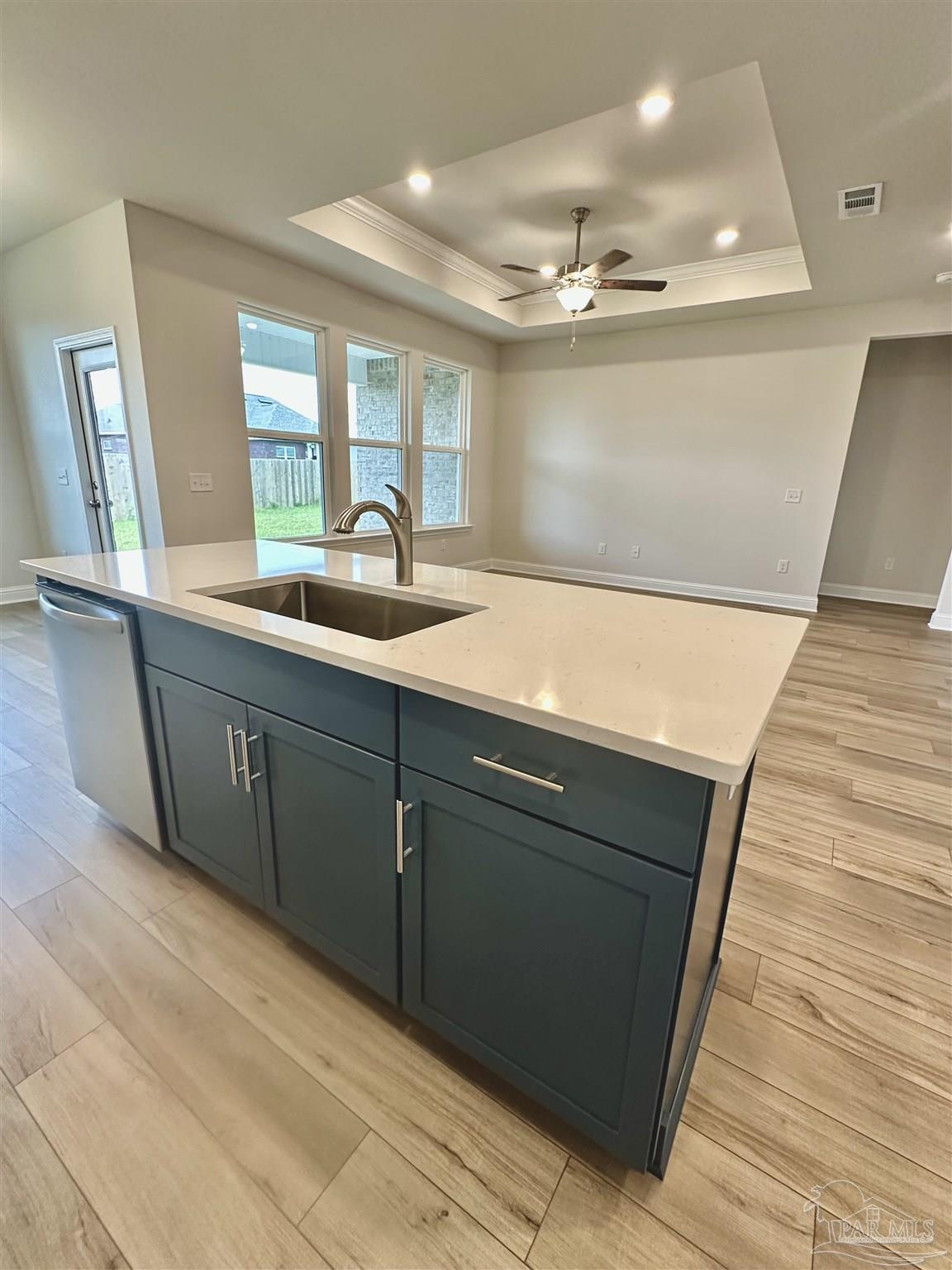1644 Slate Drive Cantonment, FL 32533 - Photo 10 of 28 a kitchen with a sink and a large mirror