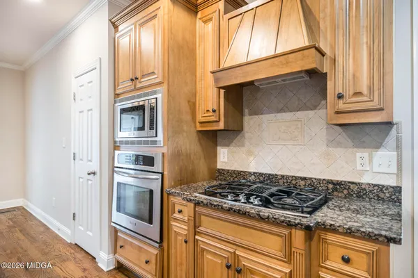 a kitchen with a stove and a sink
