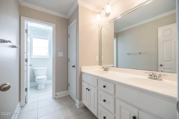 an empty room with a fan and a window