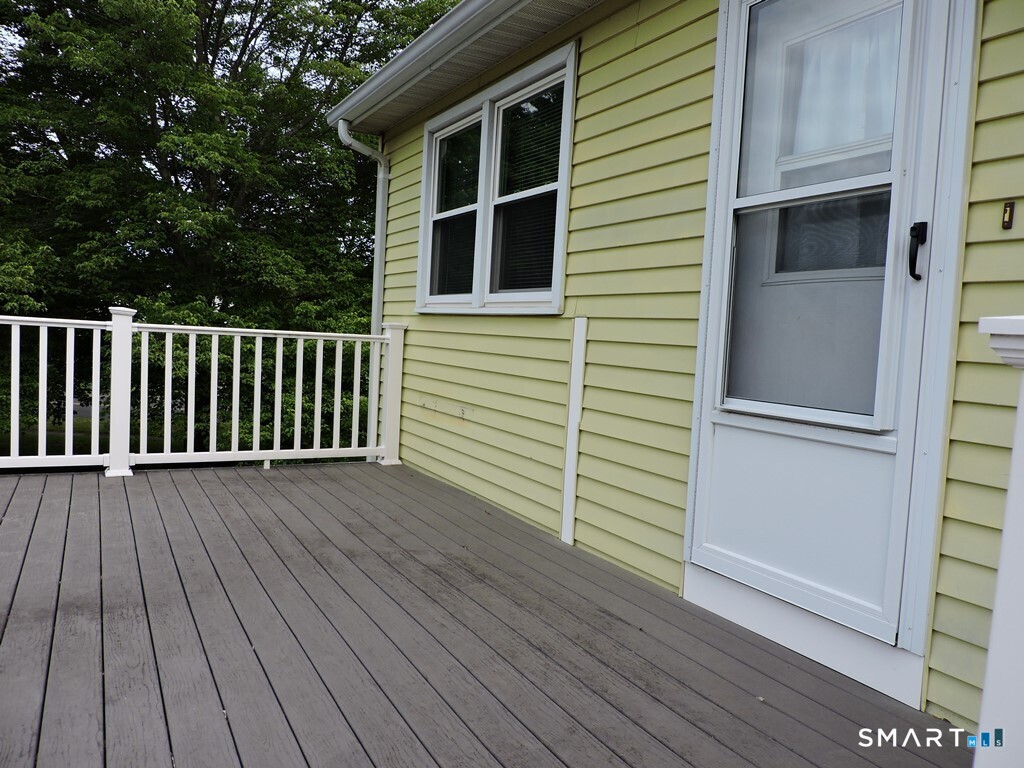 269 Griffin Road South Windsor, CT 06074 - Photo 33 of 36 a view of deck space with wooden floor and fence