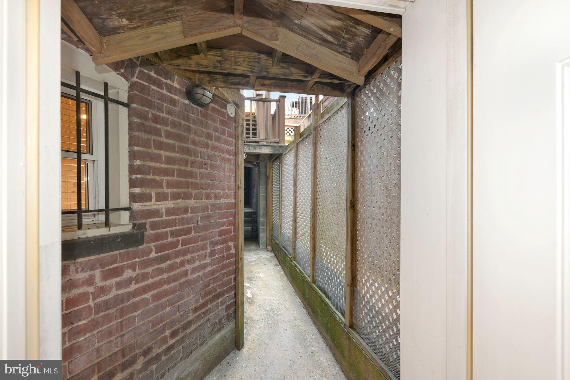 2721 Ontario Road Northwest, Unit B Washington, DC 20009 - Photo 21 of 21 Rear exit through garage