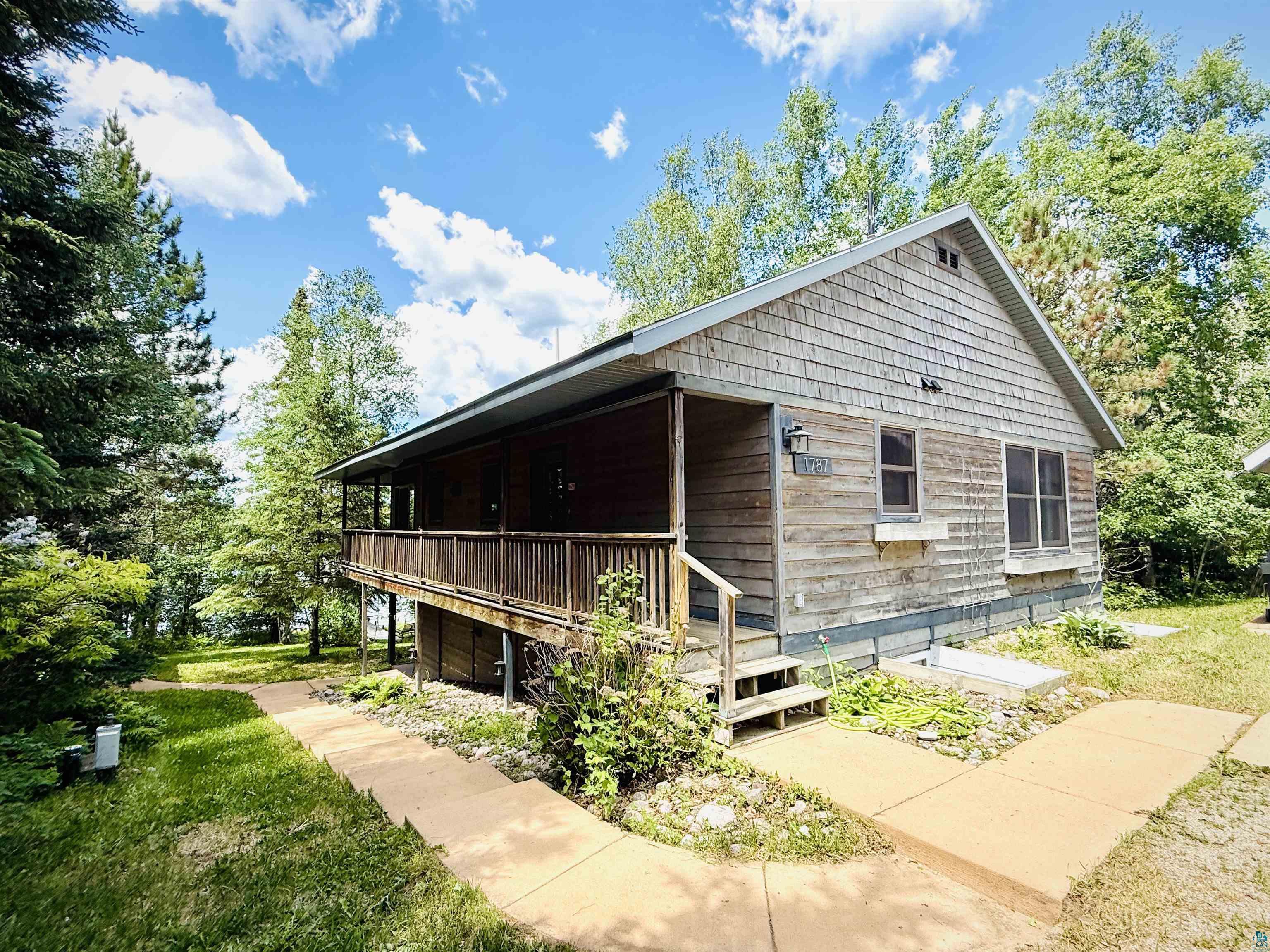 1787 North Bay Road Ely, MN 55731 - Photo 3 of 40 Exterior featuring wood shingle siding and a covered wood deck
