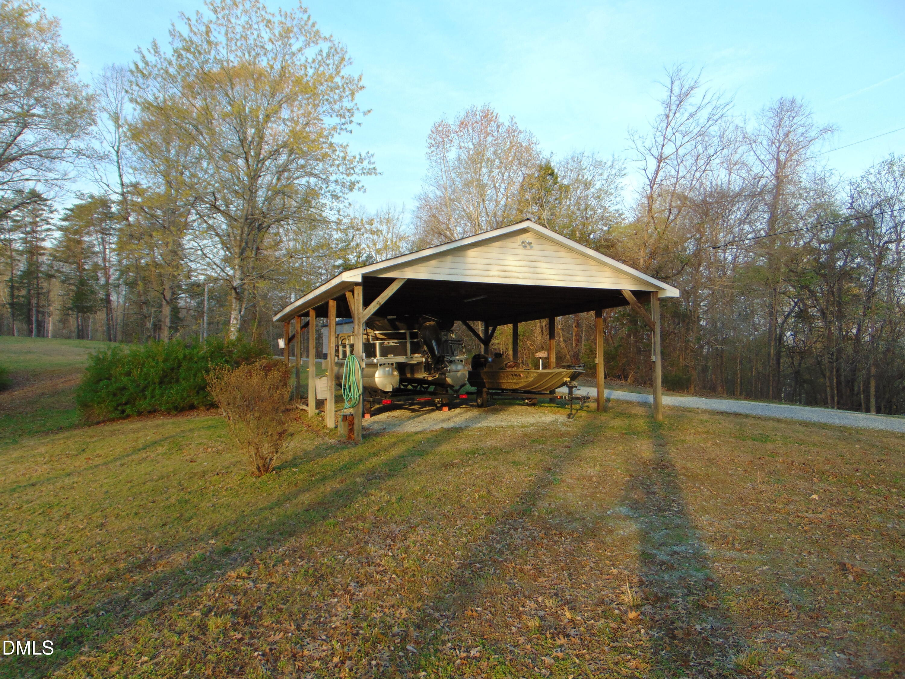 130 Lake View Road Prospect Hill, NC 27314 - Photo 27 of 73 a view of a house with backyard and trees