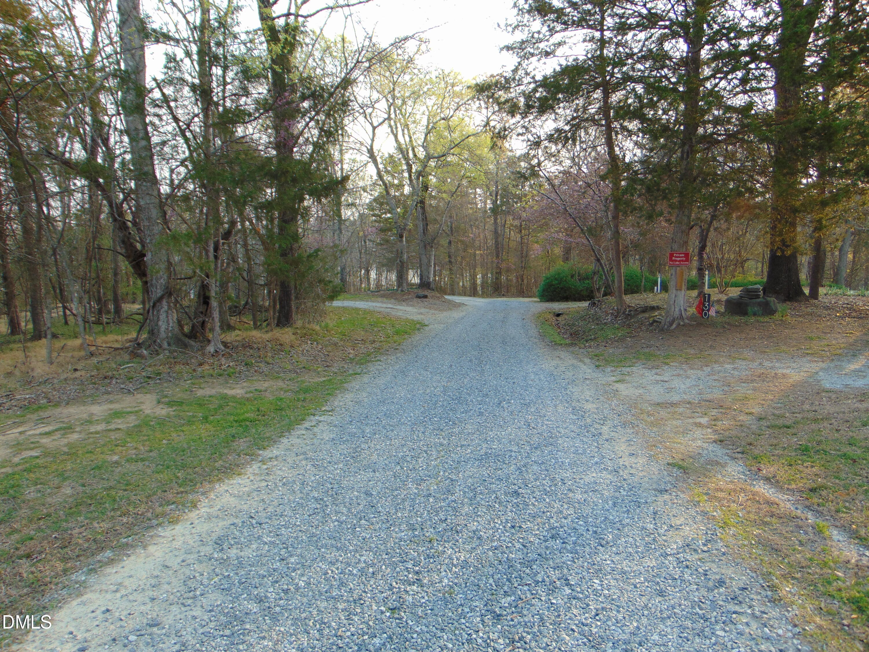 130 Lake View Road Prospect Hill, NC 27314 - Photo 31 of 73 a backyard of a house with trees and swing