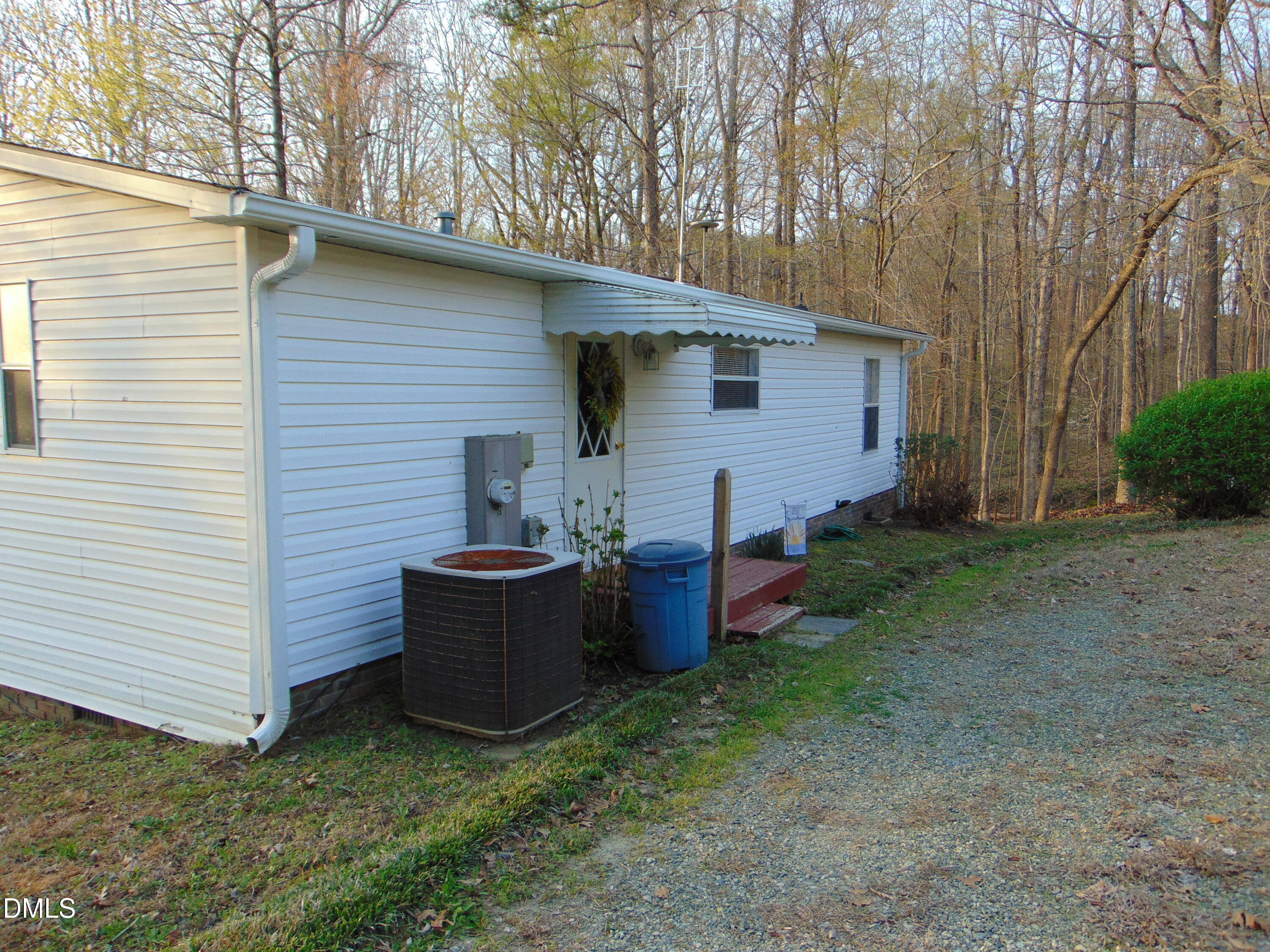 130 Lake View Road Prospect Hill, NC 27314 - Photo 34 of 73 a view of a backyard with plants and a large tree