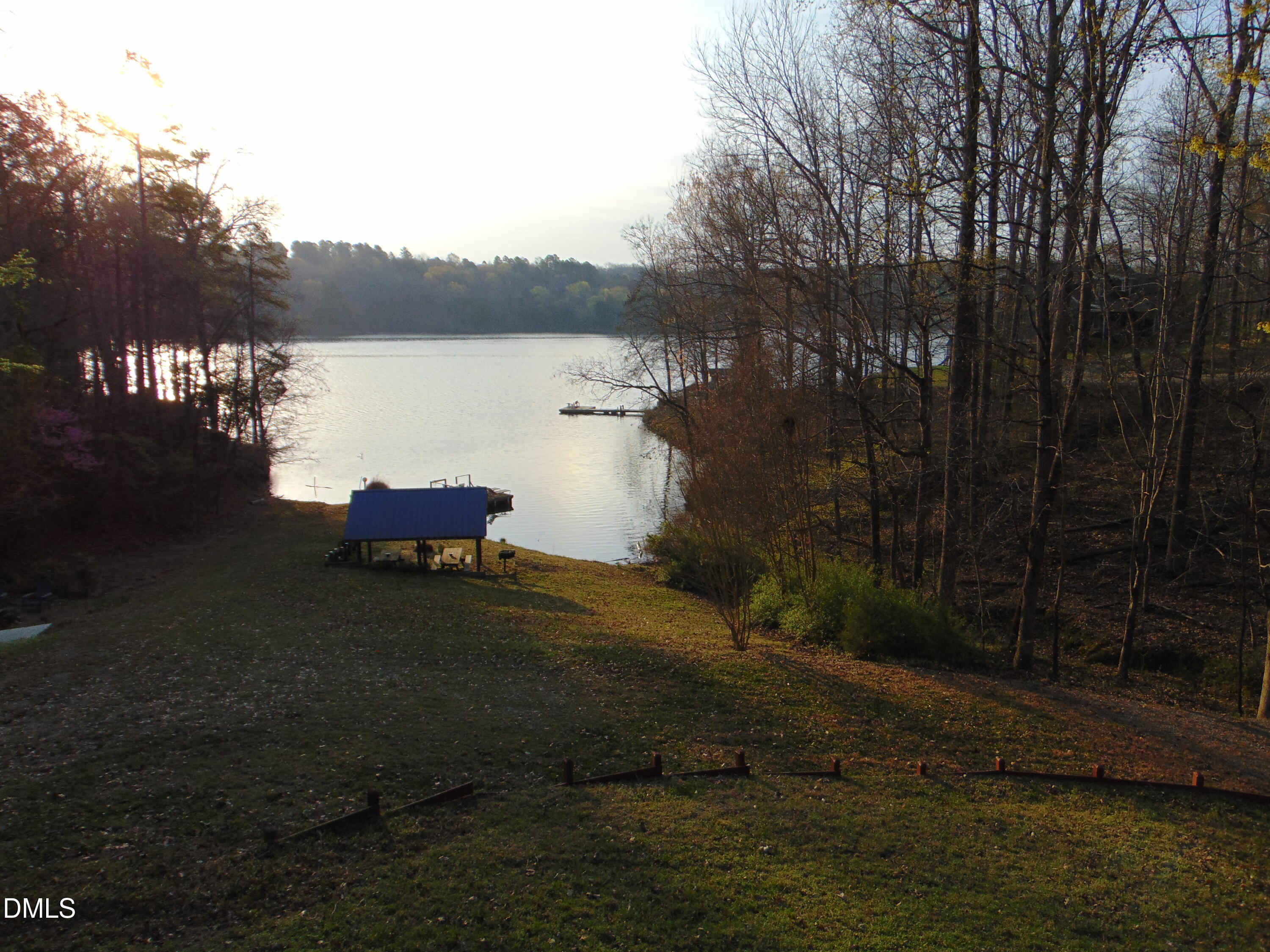 130 Lake View Road Prospect Hill, NC 27314 - Photo 50 of 73 a backyard of a house with table and chairs