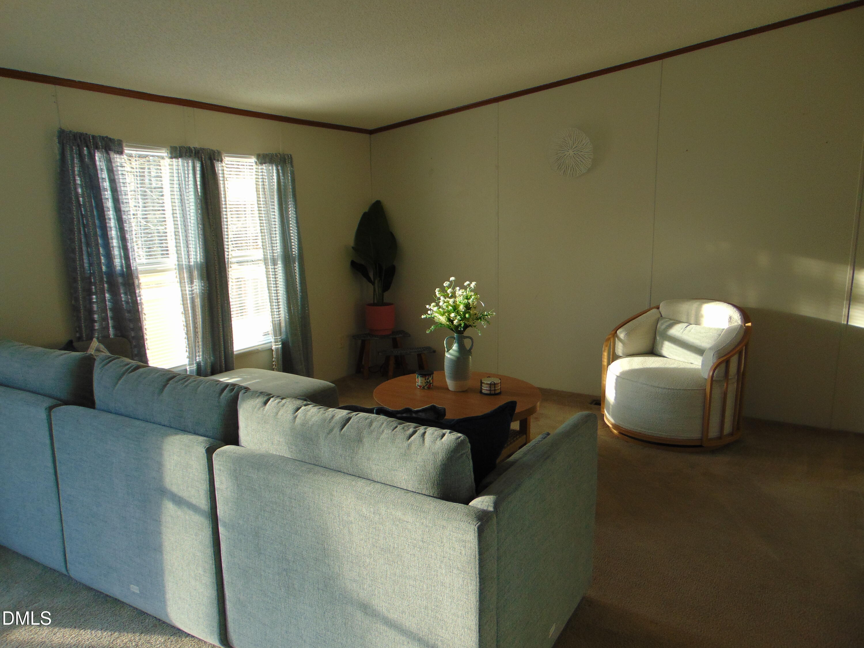 130 Lake View Road Prospect Hill, NC 27314 - Photo 53 of 73 a living room with furniture and a large window