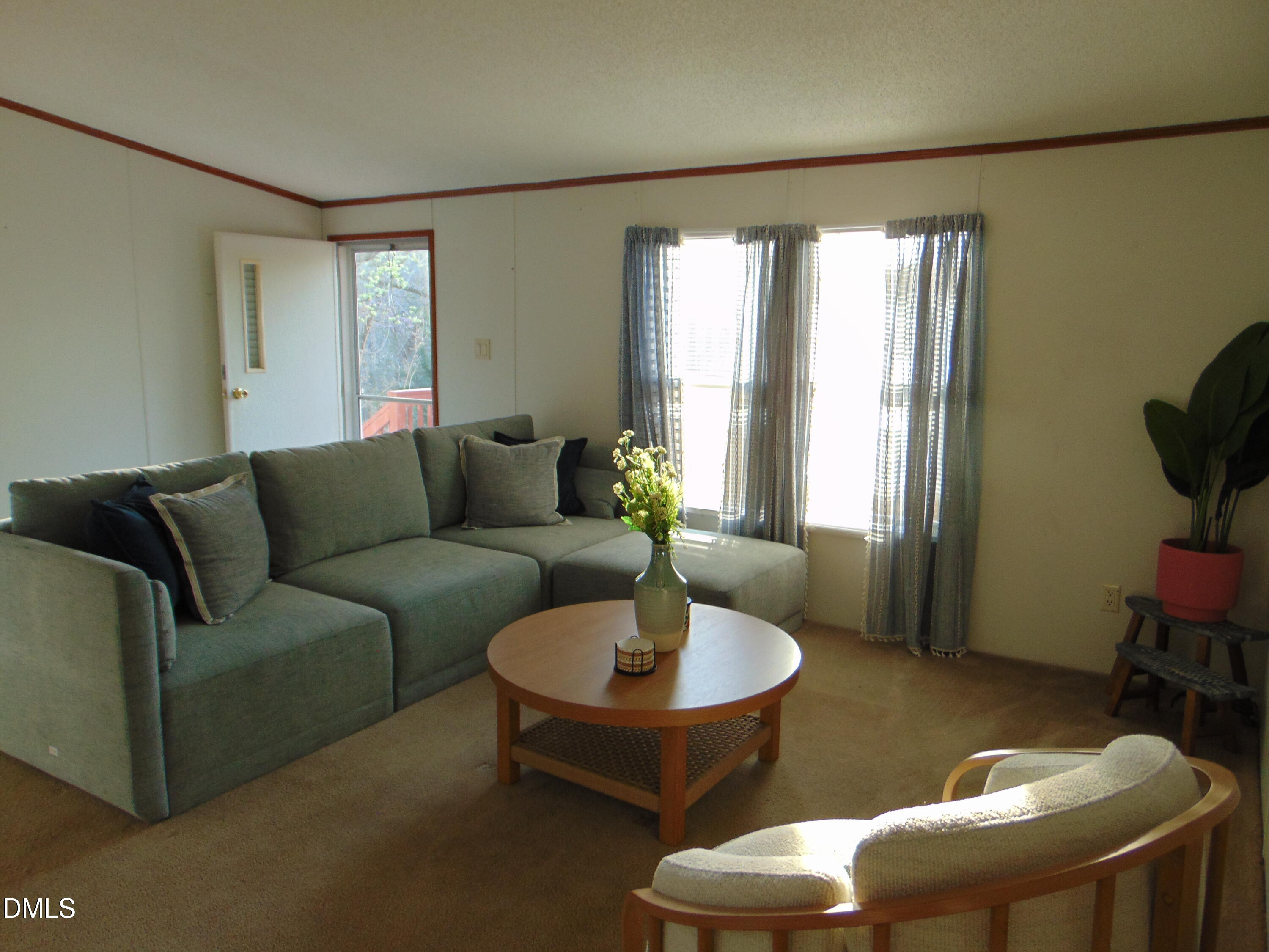 130 Lake View Road Prospect Hill, NC 27314 - Photo 54 of 73 a living room with furniture and a window